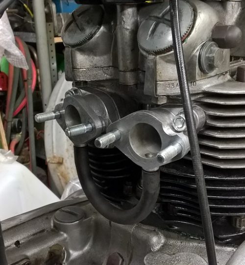 Twin carb manifolds